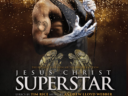 Man signing into a microphone on the poster for Jesus Christ Superstar