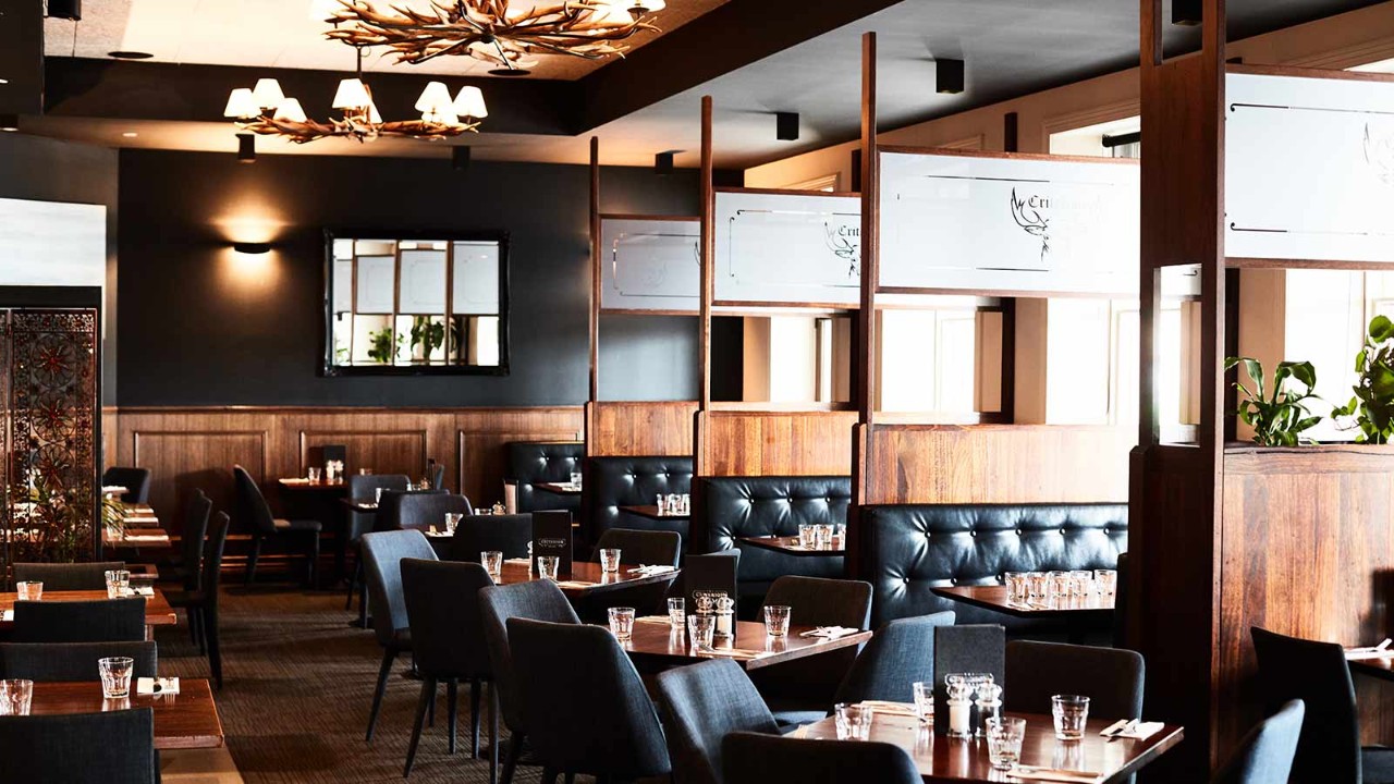 Inside the recently refurbished Criterion Hotel with cosy black booth and walnut timber interiors.